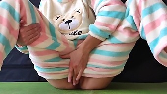 Young Woman In Sleepwear Stimulates Her Genitals And Experiences A Female Ejaculation Climax
